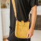 Millie Mini Nylon Crossbody Bag in Mustard