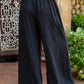 Up To Date Pleated Wide Leg Pants In Black